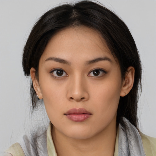 Neutral white young-adult female with long  brown hair and brown eyes