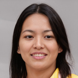 Joyful asian young-adult female with long  brown hair and brown eyes