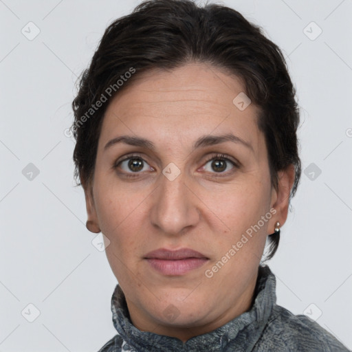 Joyful white adult female with short  brown hair and brown eyes