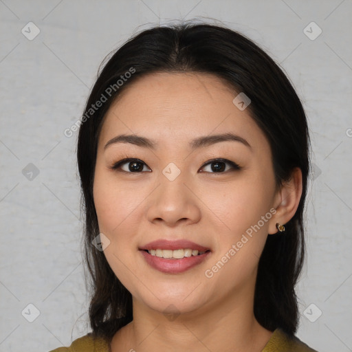 Joyful asian young-adult female with medium  brown hair and brown eyes