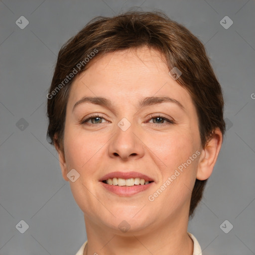 Joyful white adult female with short  brown hair and brown eyes