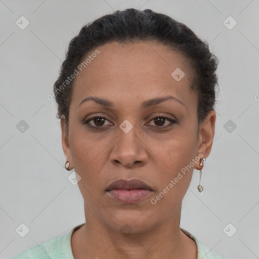 Joyful latino adult female with short  brown hair and brown eyes