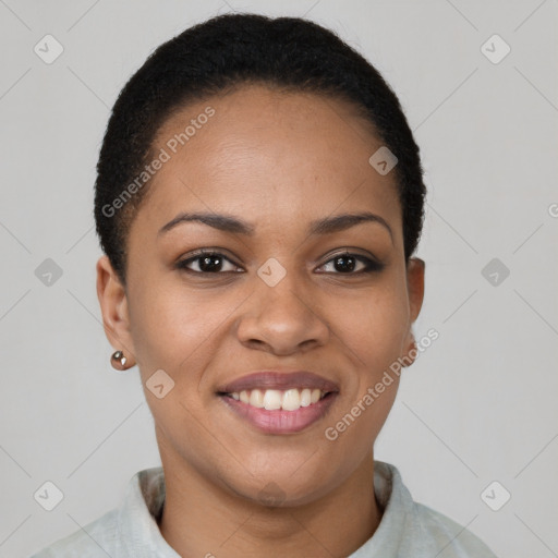 Joyful black young-adult female with short  brown hair and brown eyes