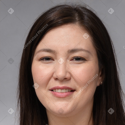 Joyful white adult female with long  brown hair and brown eyes