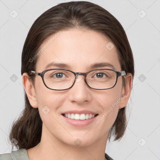 Joyful white young-adult female with medium  brown hair and grey eyes