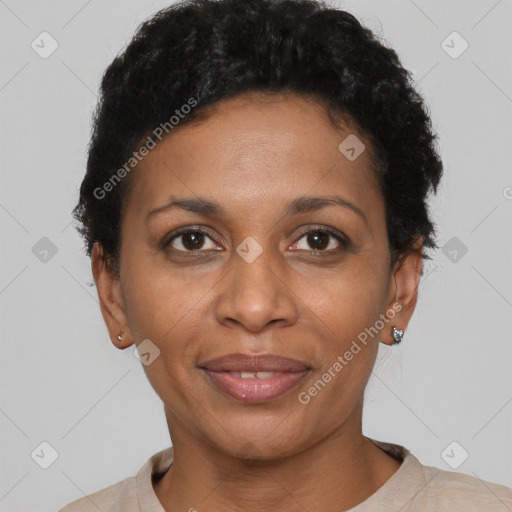 Joyful black adult female with short  brown hair and brown eyes