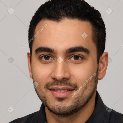 Joyful white young-adult male with short  black hair and brown eyes