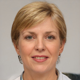 Joyful white adult female with medium  brown hair and grey eyes