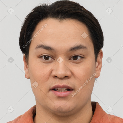 Joyful asian young-adult male with short  brown hair and brown eyes