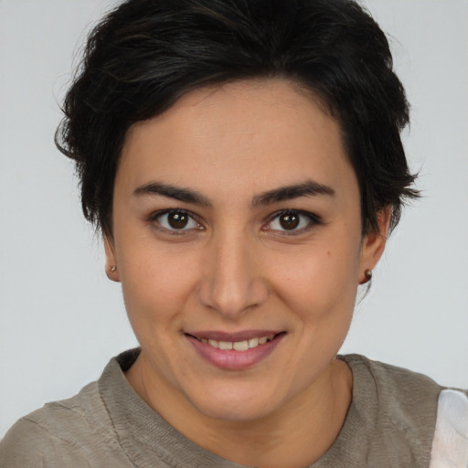 Joyful white young-adult female with short  brown hair and brown eyes