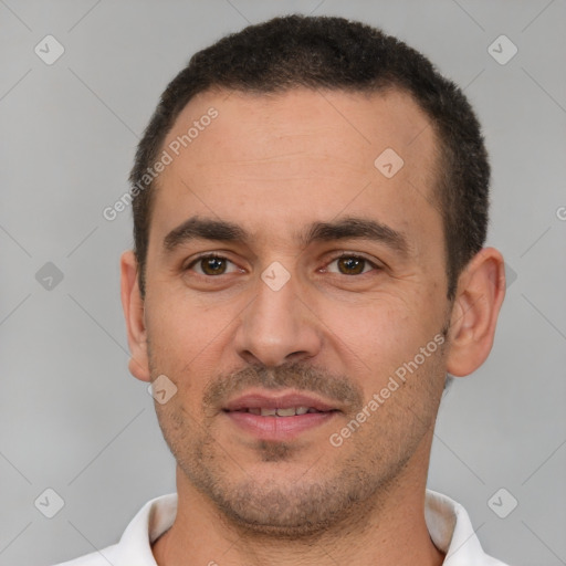 Joyful white young-adult male with short  brown hair and brown eyes