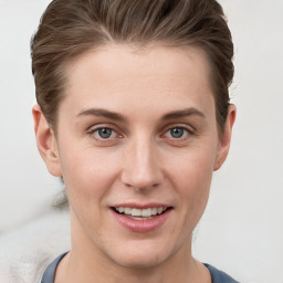 Joyful white young-adult female with short  brown hair and grey eyes