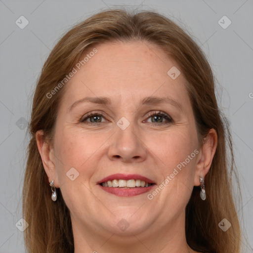 Joyful white adult female with long  brown hair and grey eyes