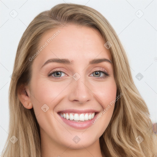 Joyful white young-adult female with long  brown hair and blue eyes