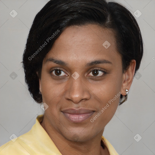 Joyful black adult female with medium  brown hair and brown eyes