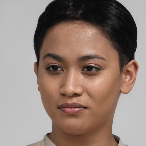 Joyful asian young-adult female with short  black hair and brown eyes