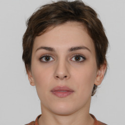 Neutral white young-adult female with short  brown hair and brown eyes