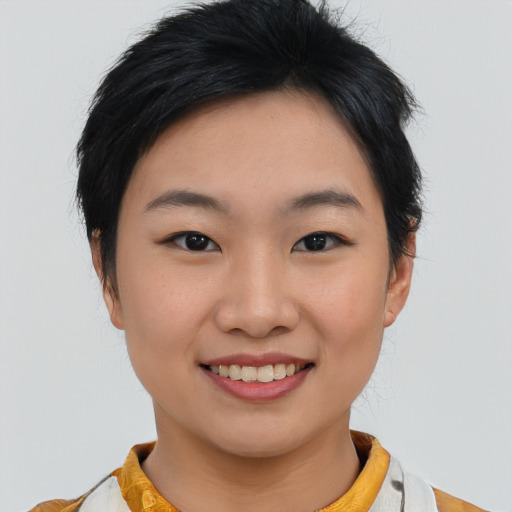 Joyful asian young-adult female with medium  black hair and brown eyes