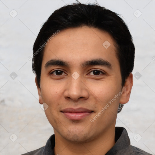 Joyful latino young-adult male with short  black hair and brown eyes