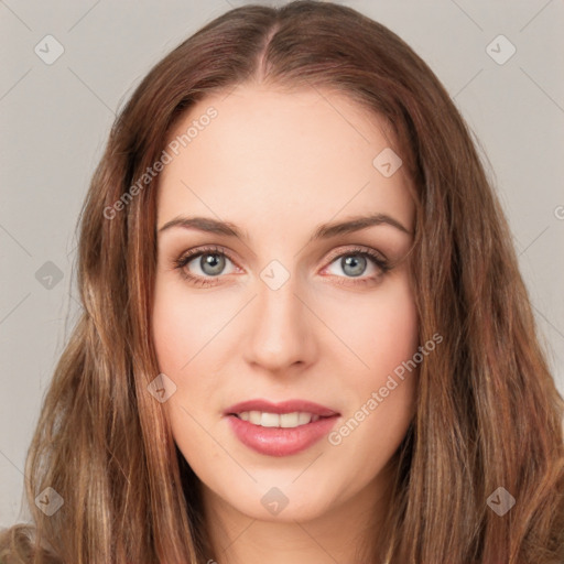 Joyful white young-adult female with long  brown hair and green eyes