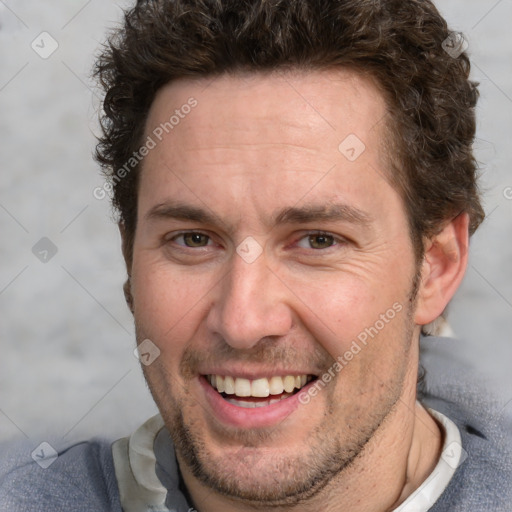 Joyful white adult male with short  brown hair and grey eyes