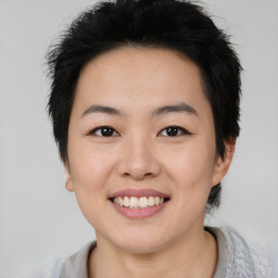 Joyful asian young-adult female with short  black hair and brown eyes