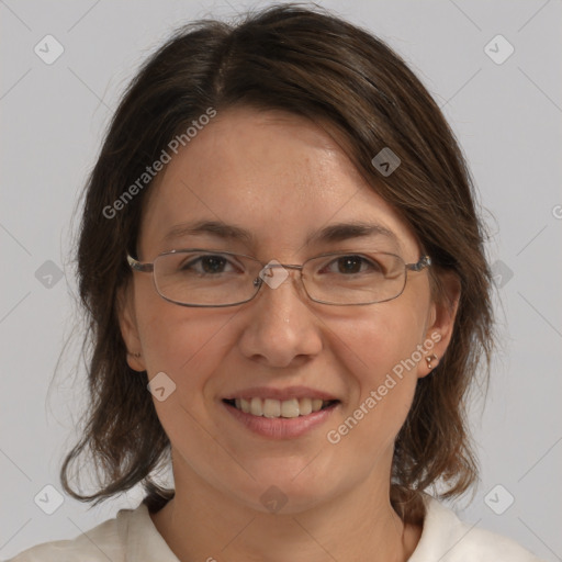 Joyful white adult female with medium  brown hair and brown eyes