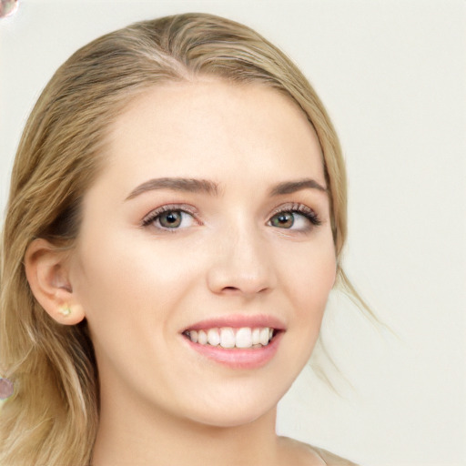 Joyful white young-adult female with long  brown hair and blue eyes