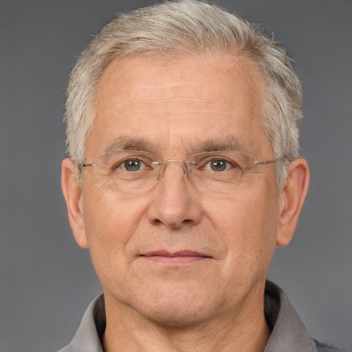 Neutral white middle-aged male with short  gray hair and brown eyes