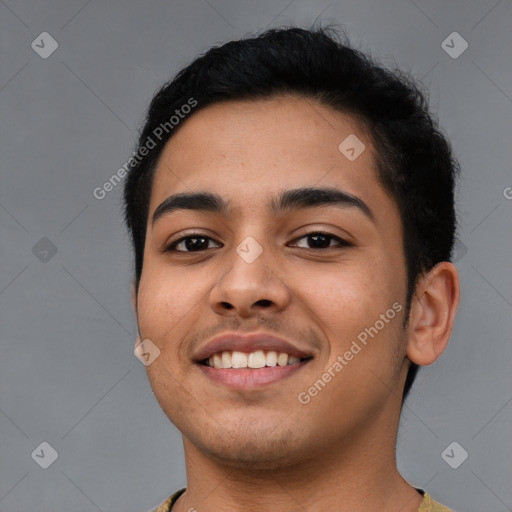 Joyful latino young-adult male with short  black hair and brown eyes