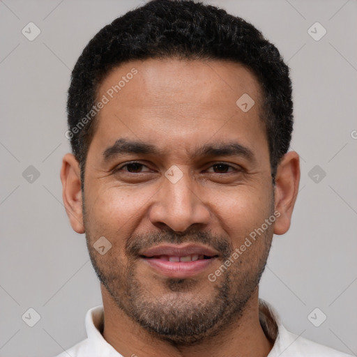 Joyful latino adult male with short  black hair and brown eyes