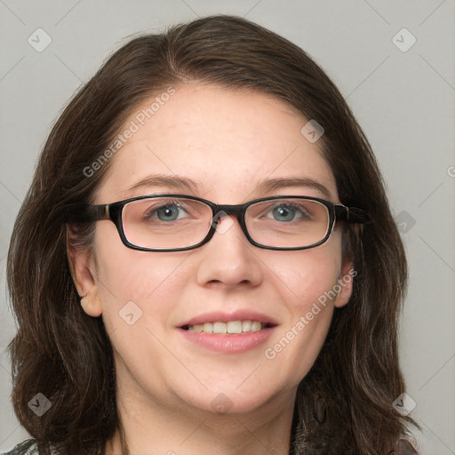 Joyful white adult female with long  brown hair and blue eyes