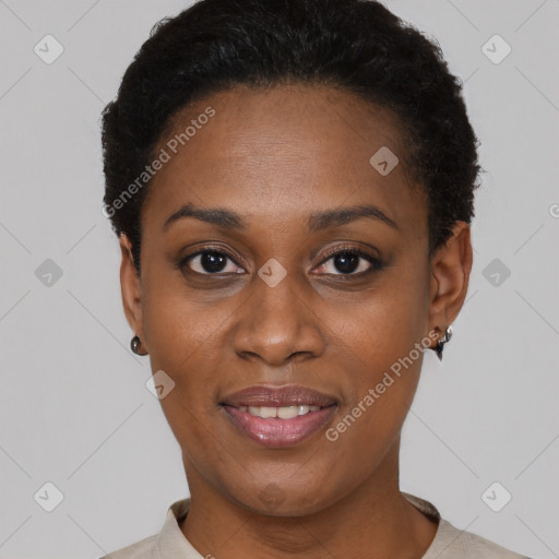 Joyful black young-adult female with short  black hair and brown eyes