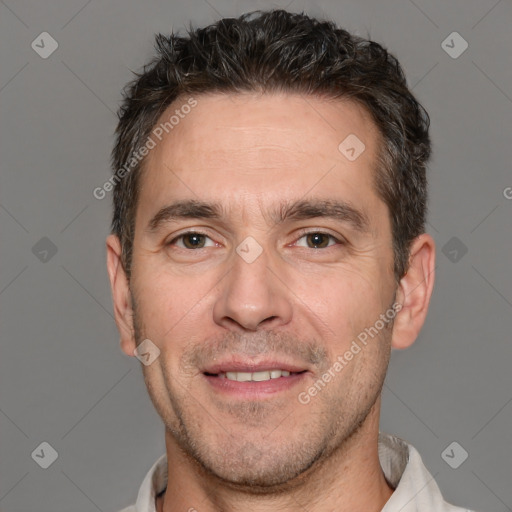 Joyful white adult male with short  brown hair and brown eyes