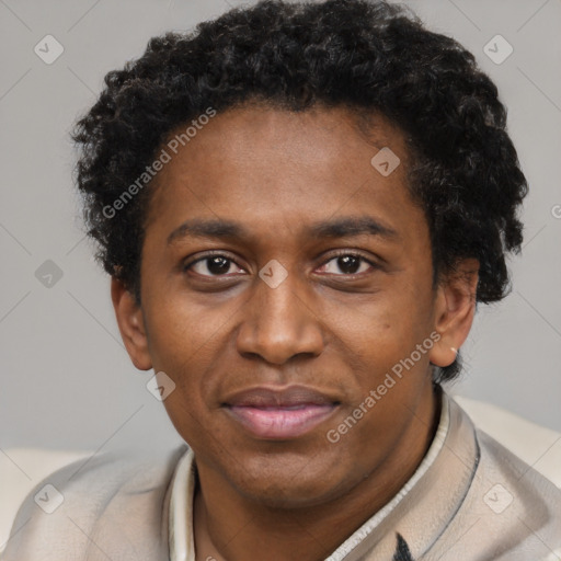 Joyful black young-adult male with short  brown hair and brown eyes