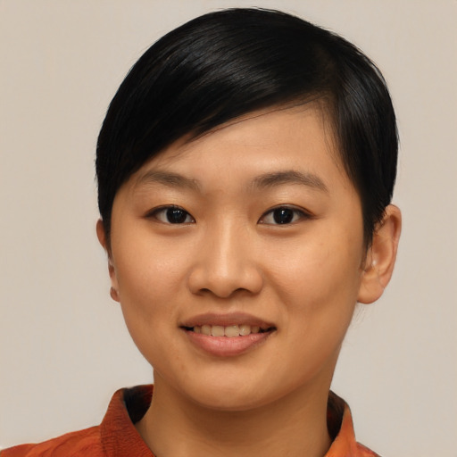 Joyful asian young-adult female with short  black hair and brown eyes