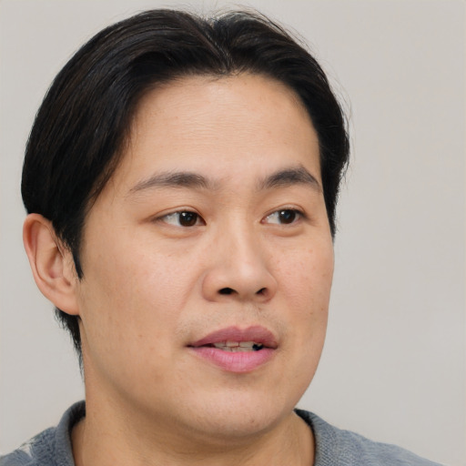 Neutral asian young-adult male with short  brown hair and brown eyes