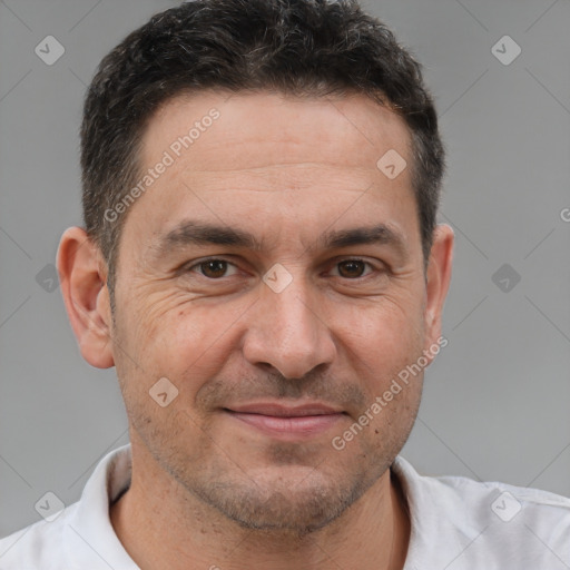 Joyful white adult male with short  brown hair and brown eyes