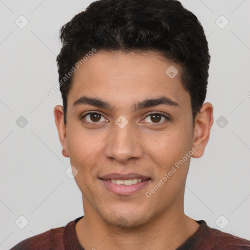 Joyful white young-adult male with short  black hair and brown eyes