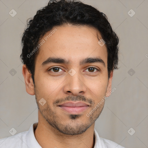 Joyful latino young-adult male with short  brown hair and brown eyes