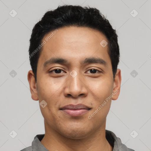 Joyful latino young-adult male with short  black hair and brown eyes