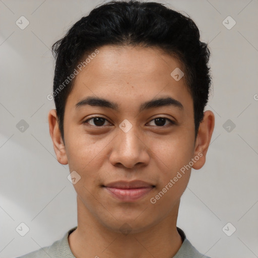 Joyful latino young-adult male with short  brown hair and brown eyes