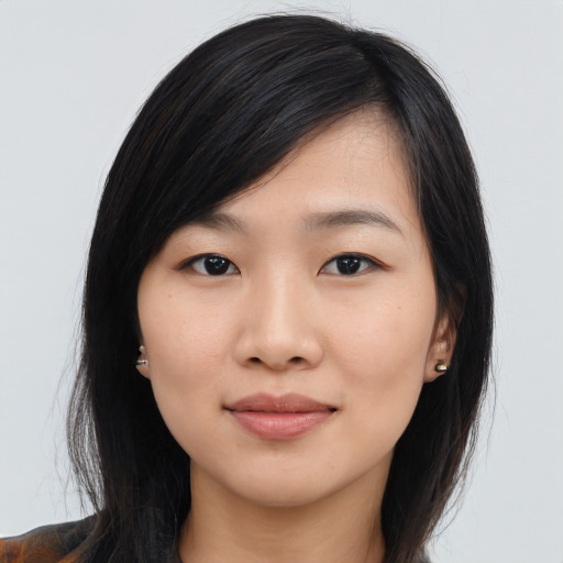 Joyful asian young-adult female with long  black hair and brown eyes