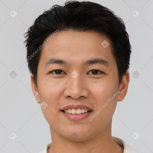 Joyful asian young-adult male with short  black hair and brown eyes