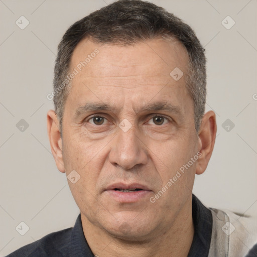 Joyful white middle-aged male with short  brown hair and brown eyes