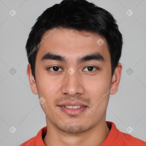 Joyful white young-adult male with short  black hair and brown eyes