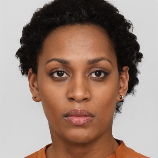 Neutral black young-adult female with short  black hair and brown eyes