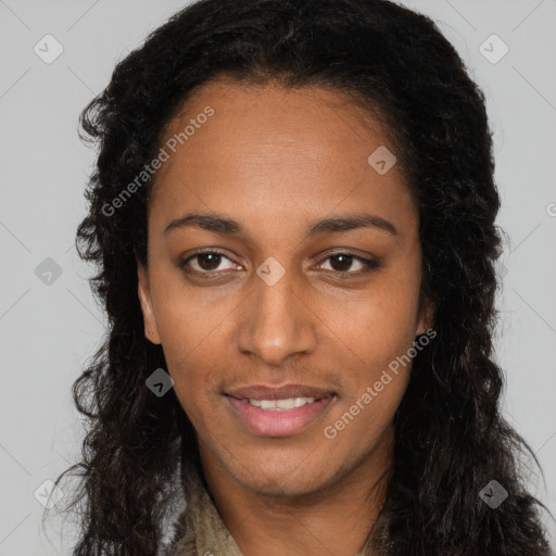 Joyful black young-adult female with long  brown hair and brown eyes