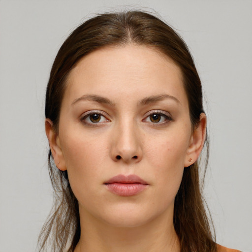 Neutral white young-adult female with long  brown hair and brown eyes