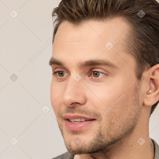 Joyful white young-adult male with short  brown hair and brown eyes